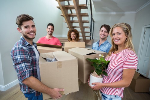 Moving team preparing boxes and furniture in Uxbridge