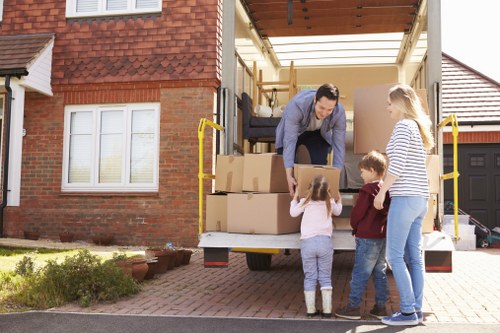 Furniture pick-up service removing a sofa in Uxbridge