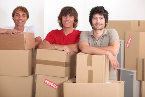 Professional movers in Uxbridge transporting office equipment with care