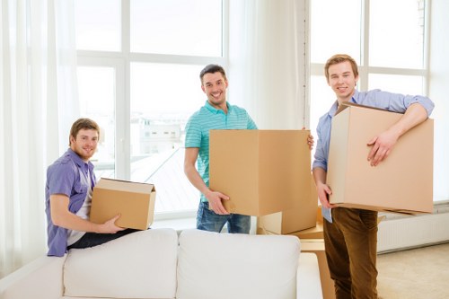 Professional movers handling furniture during a same day move
