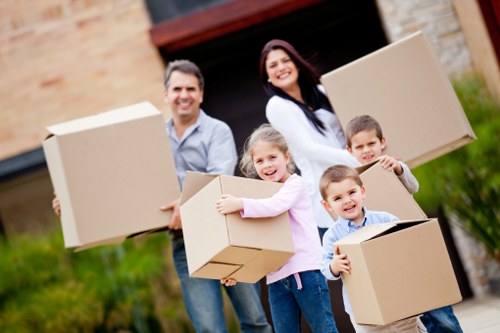 Professional movers transporting furniture during a same day removal in Uxbridge