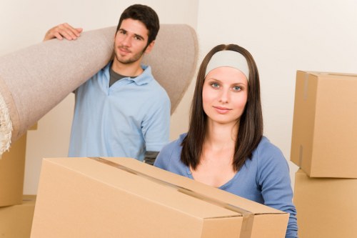 A reliable moving crew in Uxbridge handling furniture during a local move