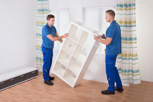 Professional man and van Uxbridge service loading furniture into a van