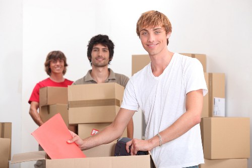 Professional removals team packing boxes for a Uxbridge house move